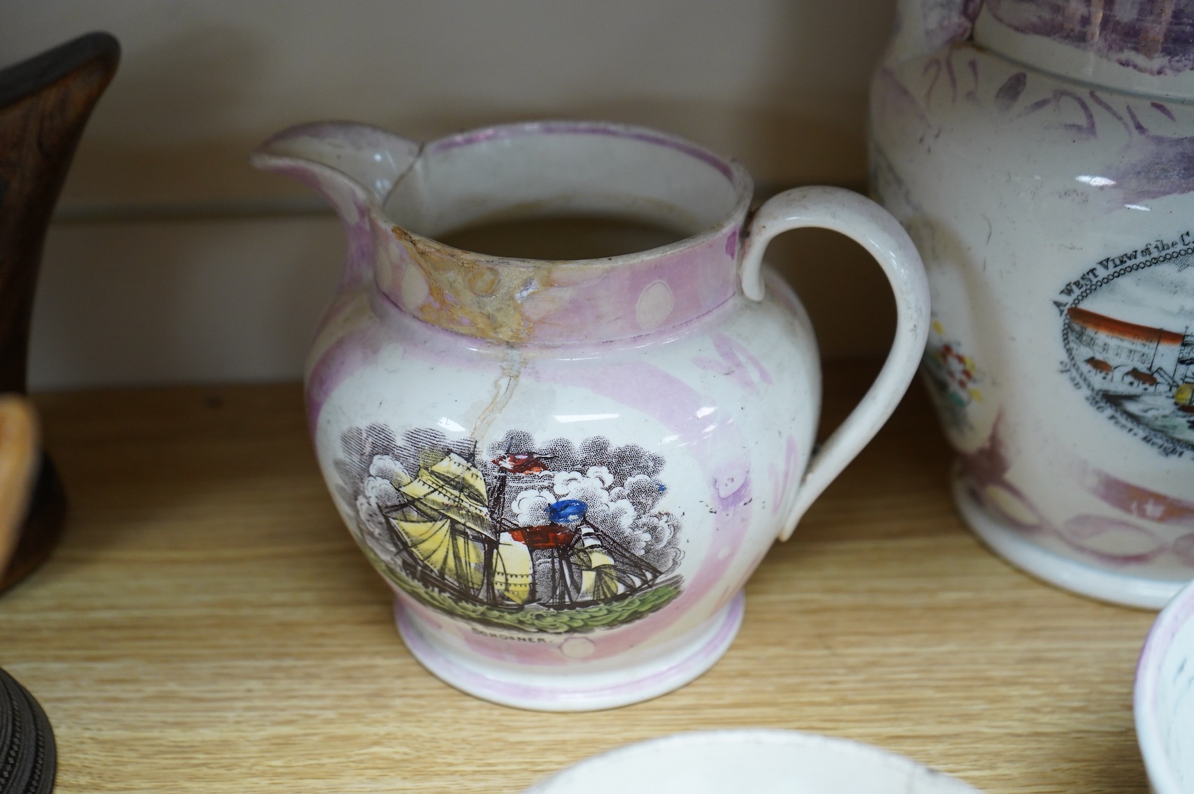 Six early 19th century commemorative jugs and bowls, three with transfer printed scenes of the cast iron bridge over the River Wear commemorating the opening in 1796, together with three others with naval themes, largest